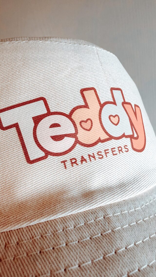 A Teddy Transfers DTF print on a white bucket hat