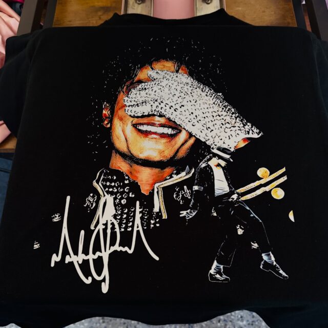 A halftone Michael Jackson DTF print on a black tee