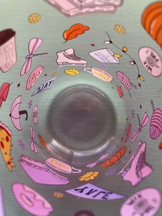UV DTF transfers on a glass cup, seen from inside