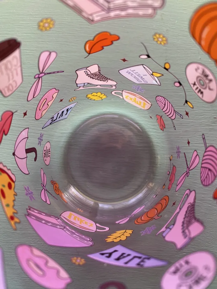 UV DTF transfers on a glass cup, seen from inside
